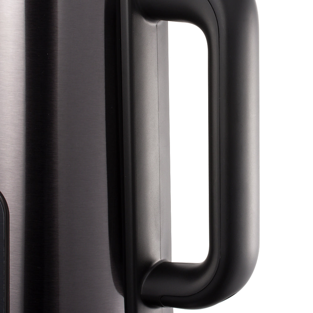 Close-up of a black handle on a metallic surface