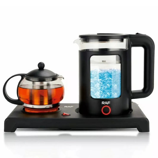 Black electric tea maker with glass teapot on a white background