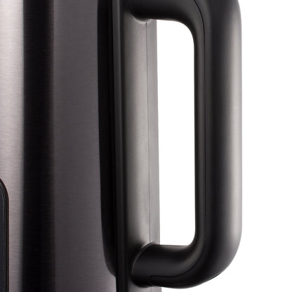 Close-up of a black handle on a metallic surface